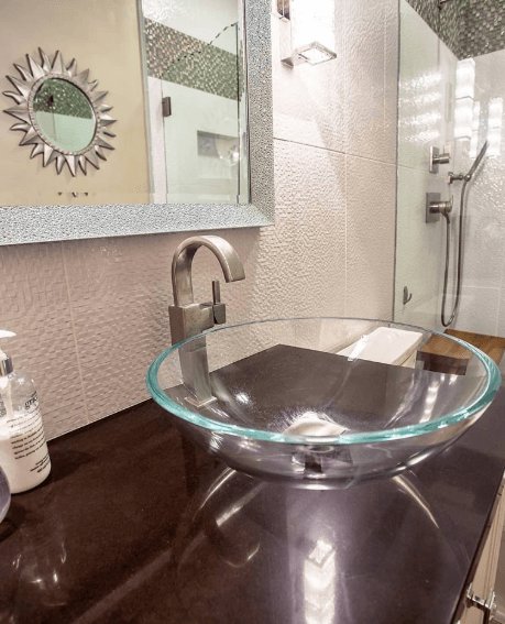modern style bathroom with gless sink basin - Leslie Kate photo